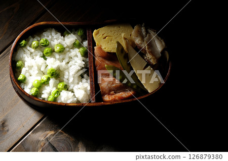 Bean and rice lunch box with plenty of side dishes 126879380