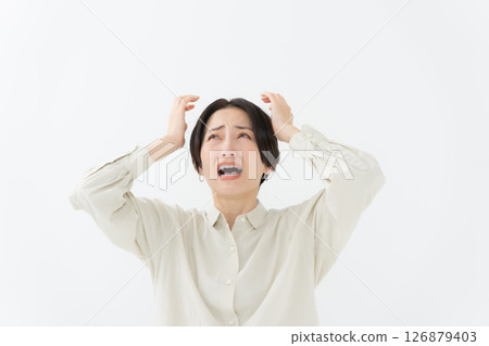 A woman holding a head 126879403