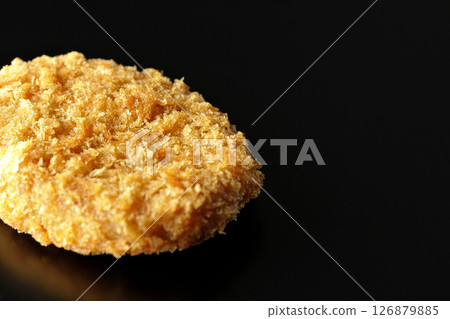 Beef croquette photographed against a black background Beef croquette photographed against a black background 126879885