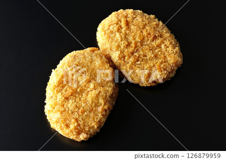 Beef croquette photographed against a black background 126879959