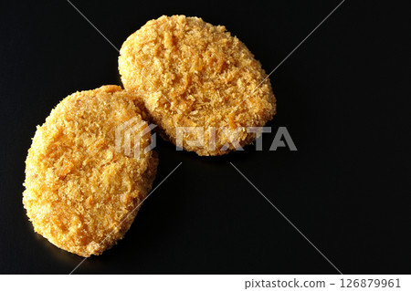 Beef croquette photographed against a black background Beef croquette photographed against a black background 126879961