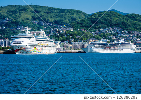 Cruise ship arriving at Nagasaki Port (Blue Dream Melody & Regatta) from the opposite shore [Nagasaki City] 126880292