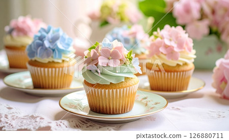 Hydrangea cupcakes on antique tableware 126880711