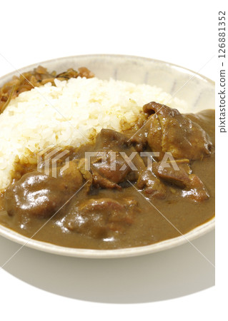 Chicken curry with large chunks of chicken photographed on a white background 126881352