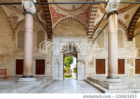 istanbul, turkiye - aug 18 2015: court of blue mosque. open door between columns 126881653