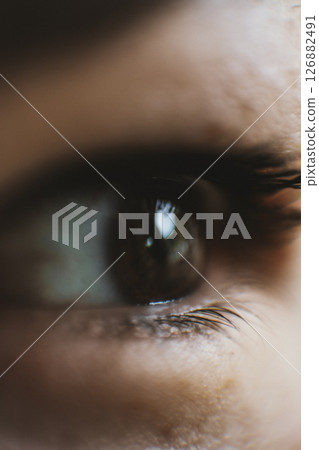 Close-Up of a Child's Eye with Glowing Reflection 126882491