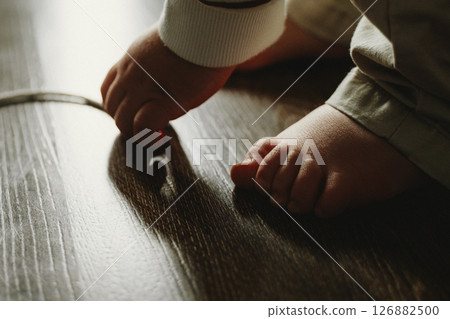 Toddler Exploring Floor With Curiosity 126882500