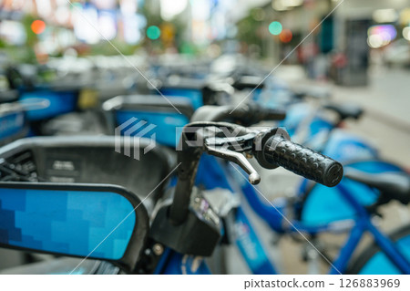 Multiple Citi Bikes are parked on a city street in New York. A symbol of urban transportation and sustainable mobility. 126883969
