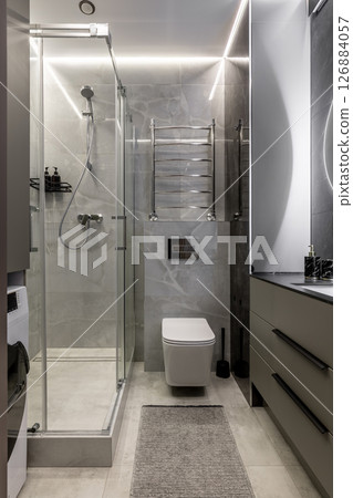 Minimalist Bathroom with Glass Shower and Toilet Minimalist Bathroom with Glass Shower and Toilet 126884057