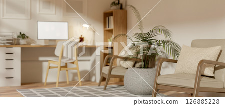 Wooden table with computer and bookshelf in room corner near the pair of armchair. Home interior. Wooden table with computer and bookshelf in room corner near the pair of armchair. Home interior. 126885228