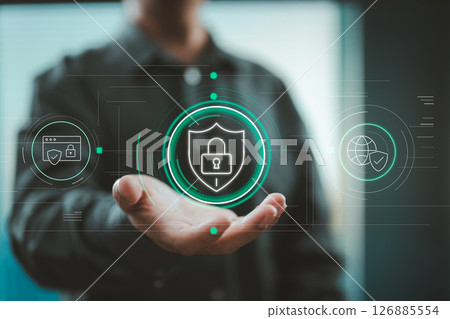 Hand holding digital security shield with lock icon for online privacy protection 126885554