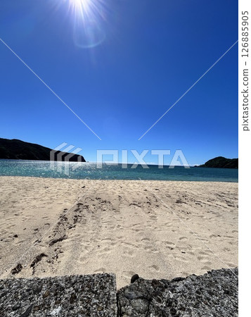 A tropical island beach in midsummer A tropical island beach in midsummer 126885905