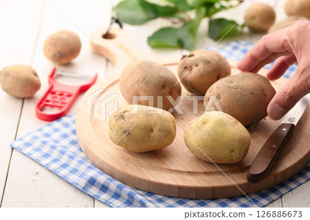 Freshly harvested potatoes still with dirt on them 126886673