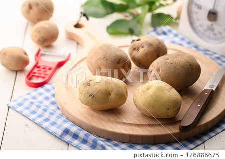 Freshly harvested potatoes still with dirt on them 126886675