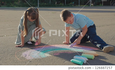 Kid child baby boy girl Rainbow drawing with chalk, kids sitting on road, children collaboration, expression through color, joyful sketching, art adventure, kids outdoor ideas, pastel colors on cement 126887257