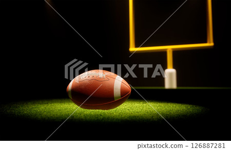 Rugby ball with rugby posts on field 126887281