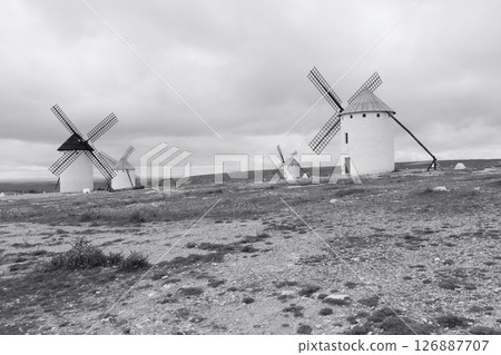 a group of white wind mill in rural landscape a group of white wind mill in rural landscape 126887707