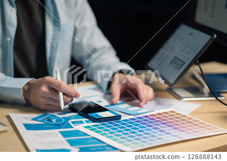 Male coder or developer working overtime using a computer display in problem solving at workplace. Male coder or developer working overtime using a computer display in problem solving at workplace. 126888143