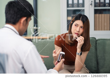 Female patient receiving therapy for depression and stress in a psychiatric clinic. Female patient receiving therapy for depression and stress in a psychiatric clinic. 126888395