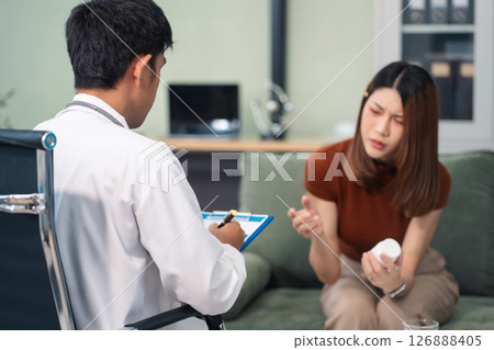 Female patient receiving therapy for depression and stress in a psychiatric clinic. Female patient receiving therapy for depression and stress in a psychiatric clinic. 126888405