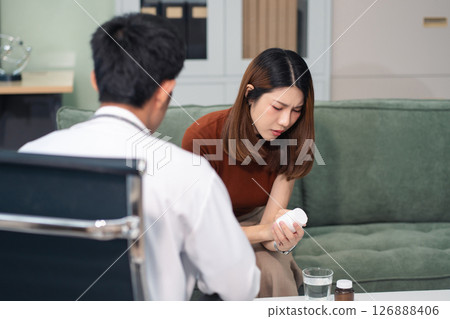 Female patient receiving therapy for depression and stress in a psychiatric clinic. Female patient receiving therapy for depression and stress in a psychiatric clinic. 126888406