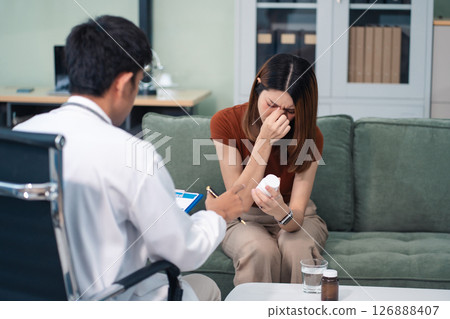 Female patient receiving therapy for depression and stress in a psychiatric clinic. Female patient receiving therapy for depression and stress in a psychiatric clinic. 126888407
