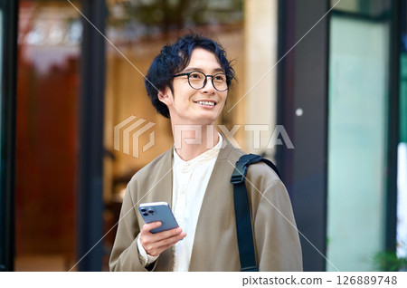 A man with a smartphone A man with a smartphone 126889748