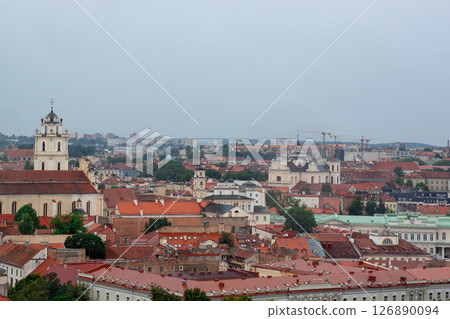Cityscape of Vilnius, Lithuania from viewpoint in a summer cloudy day. View of the old town with orange roofs. Famous tourist destination. Travel photography. 126890094