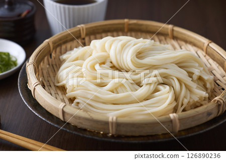 Udon noodles served in a colander 126890236