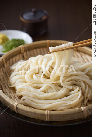 Udon noodles served in a colander 126890252
