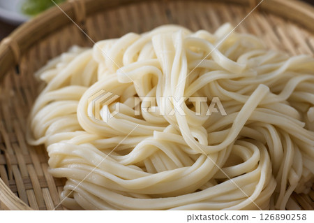 Udon noodles served in a colander 126890258
