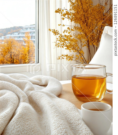 Cozy autumn morning with tea and soft blanket Cozy autumn morning with tea and soft blanket 126891151