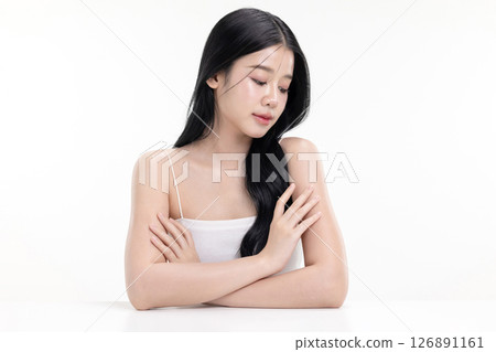 Glowing skin make up style of beautiful young Asian model isolated on white background. Glowing skin make up style of beautiful young Asian model isolated on white background. 126891161