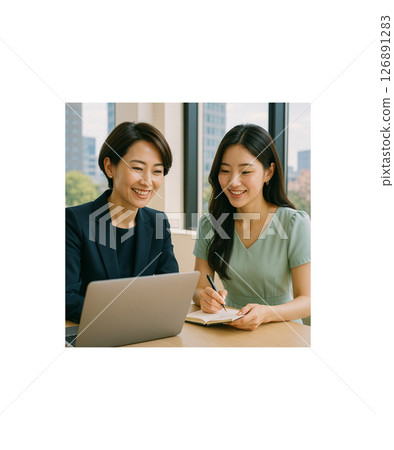 A smiling woman taking notes and her boss talking in a bright office 126891283