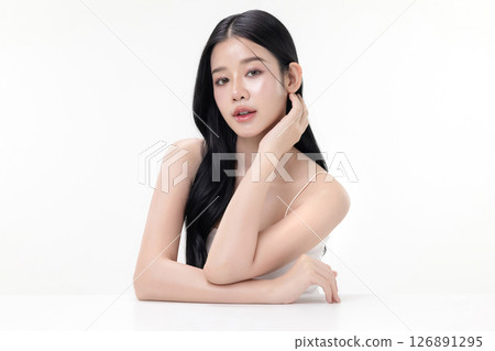 Glowing skin make up style of beautiful young Asian model isolated on white background. Glowing skin make up style of beautiful young Asian model isolated on white background. 126891295