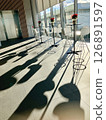 Long shadows in the room 126891597