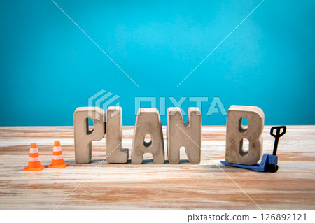 Plan B. Concrete Alphabet Letters on a White Wooden and Blue Background 126892121