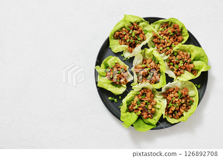 Fresh and Crispy Ground Chicken lettuce wraps 126892708