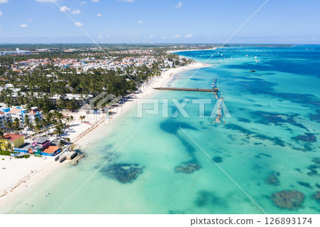 Tropical seashore with resorts, palm trees and caribbean sea. Travel destinations. Aerial view 126893174