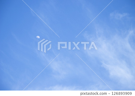 daytime moon in blue sky 126893909