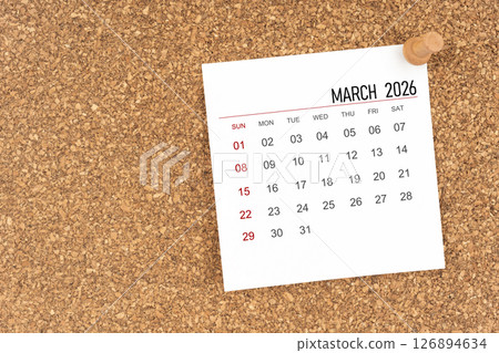 White calendar sheet for March 2026 with thumbtack on board, Position with copy space. 126894634