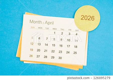 April 2026 calendar page on blue background. April 2026 calendar page on blue background. 126895279