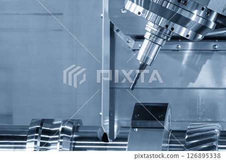 The multi-tasking CNC machine cutting the metal gear parts by solid flat nose end mill tool in the light blue scene. The multi-tasking CNC machine cutting the metal gear parts by solid flat nose end mill tool in the light blue scene. 126895338