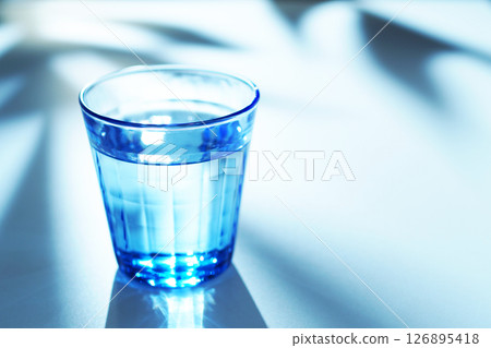 Mineral water in a blue glass Mineral water in a blue glass 126895418