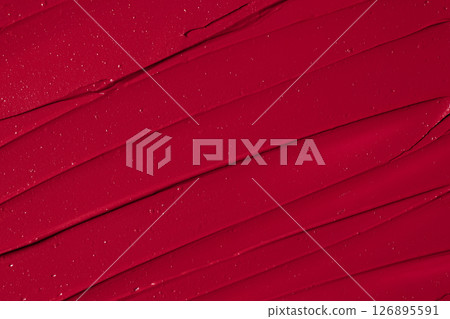 Rich red lipstick texture with smooth application and glossy finish for beauty and cosmetic themes. Red lipstick background. Rich red lipstick texture with smooth application and glossy finish for beauty and cosmetic themes. Red lipstick background. 126895591