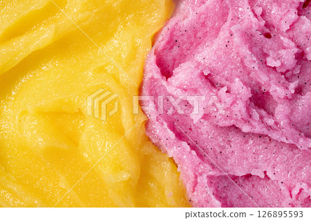 Strawberry and melon fruit scrub texture. Bright pink and yellow creamy smear with exfoliating crystals. Organic cosmetic body care peeling. Natural skincare exfoliating scrubber treatment. 126895593