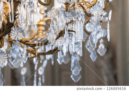 A luxurious chandelier showcasing intricate crystal ornaments 126895616