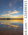 Landscape of mountains and lake at sunset and clouds reflected in the water. 126896915
