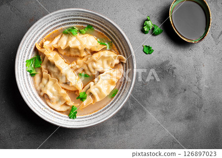 Wonton soup. Asian dumpling soup. 126897023