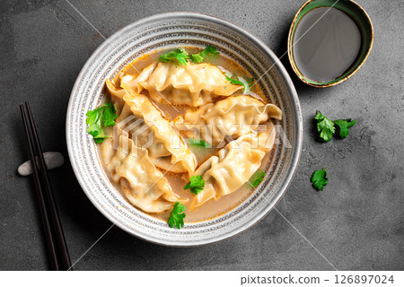 Wonton soup. Asian dumpling soup. 126897024